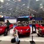 Climate activists glue themselves to sports cars