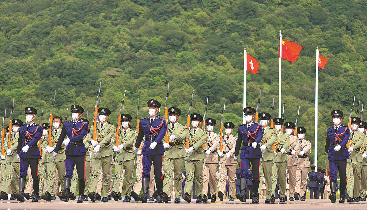 Parade by disciplined services hails national day in HK