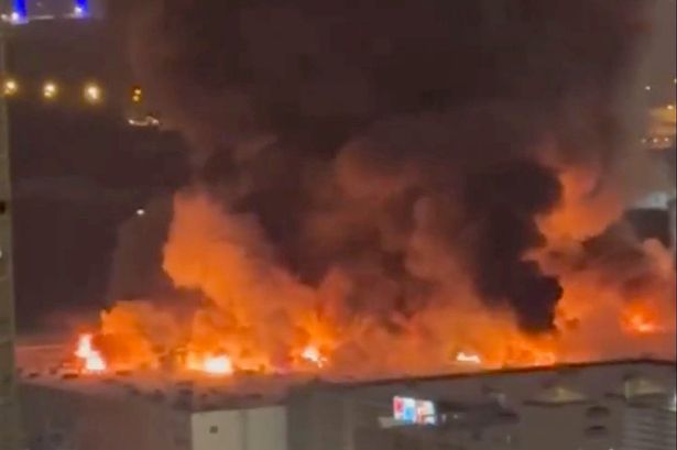 Moscow fire: Huge blaze at shopping centre as roof collapses as explosions heard