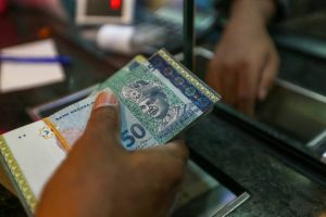 Ringgit opens flat against US dollar on external pressure