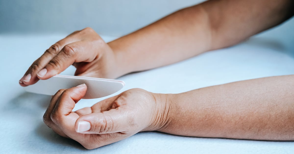 What Causes Those Vertical Black Lines on Nails? We Asked a Pro