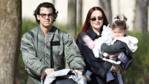 Sophie Turner & Joe Jonas Carry Their Daughters On Rare Full Family Outing