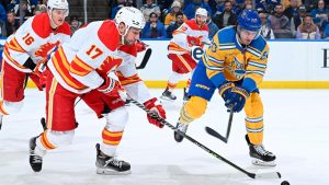 FLAMES FALL TO BLUES