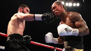 Unbeaten light-heavyweight world boxing champion Artur Beterbiev stops Britain’s Anthony Yarde in a thriller in London