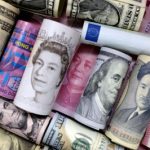 Dollar slides, yuan gains on China PMI; hot inflation lifts euro