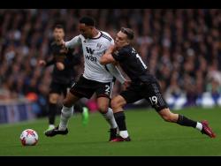 Arsenal cut through Fulham to reopen five-point gap