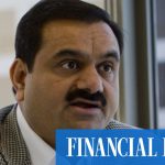 Pounded Adani pushes on with share offer, stares down critics