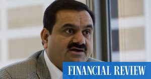 Pounded Adani pushes on with share offer, stares down critics