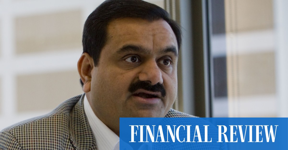 Pounded Adani pushes on with share offer, stares down critics