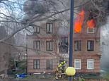 One dead as fire rips through flats in east London