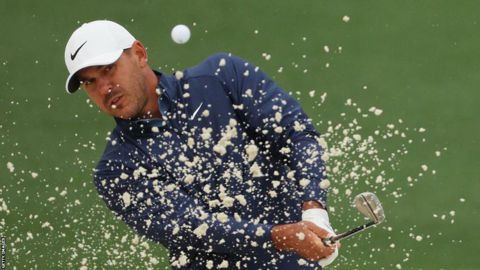 Heavy rain abandons play as Koepka leads Masters