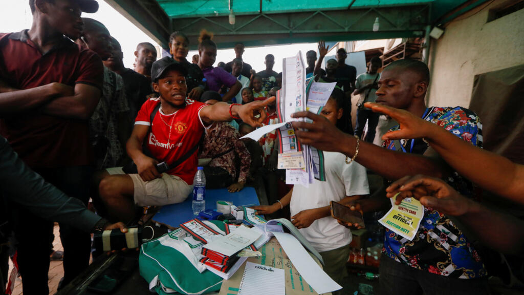 Nigeria tallies votes after tight presidential election hit by long delays