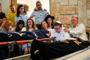 London rabbi breaks down during funeral for daughters killed in West Bank shooting