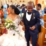 Nigerians React To Trending Video Of Groom Checking His Phone While Walking Down The Aisle With His Wife