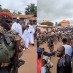 Trending video of interim President of Guinea, Mamady Doumbouya, taking a walk with his sons while being guided by heavily armed military men (video)