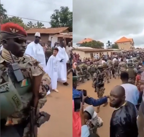 Trending video of interim President of Guinea, Mamady Doumbouya, taking a walk with his sons while being guided by heavily armed military men (video)