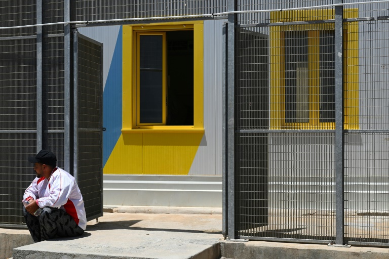 On Lampedusa, Red Cross takes over grim migrant hub