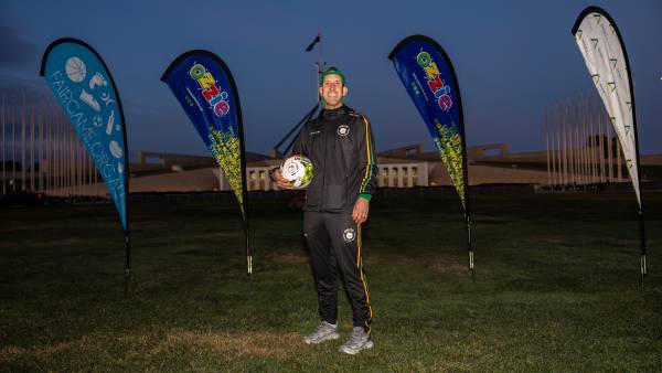 Ozzie is dribbling a soccer ball from Canberra to Sydney