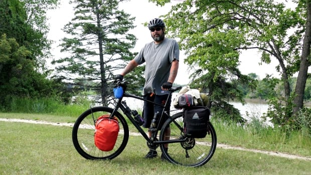 Mental health advocate’s cross-country ride hits roadblock after bike stolen in Winnipeg