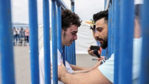 Brothers reunite after migrant ship capsizes, bringing a brief reprieve from grief in Greece