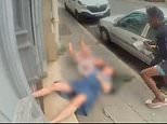 Horrifying moment homeless robber throws grandmother and her granddaughter into the street