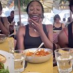 Trending VIDEO of a lady who continued eating after a bird perched on her plate and ate out of her food