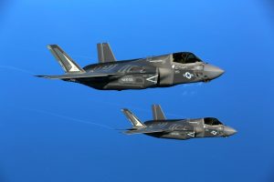 Yes, the missing F-35 jet is funny. It’s also a horribly perfect metaphor.