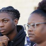 Debate over Black student’s suspension over hairstyle ramps up with probe and lawsuit…