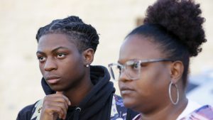 Debate over Black student’s suspension over hairstyle ramps up with probe and lawsuit…