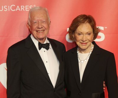 Jimmy, Rosalynn Carter surprise parade crowd at Georgia festival