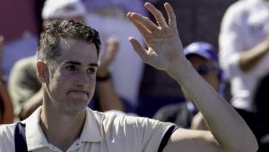 Tearful Isner retires after epic five-set US Open defeat to fellow American Mmoh