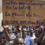 Europeans evacuated from Niger as neighboring West African juntas warn against intervention