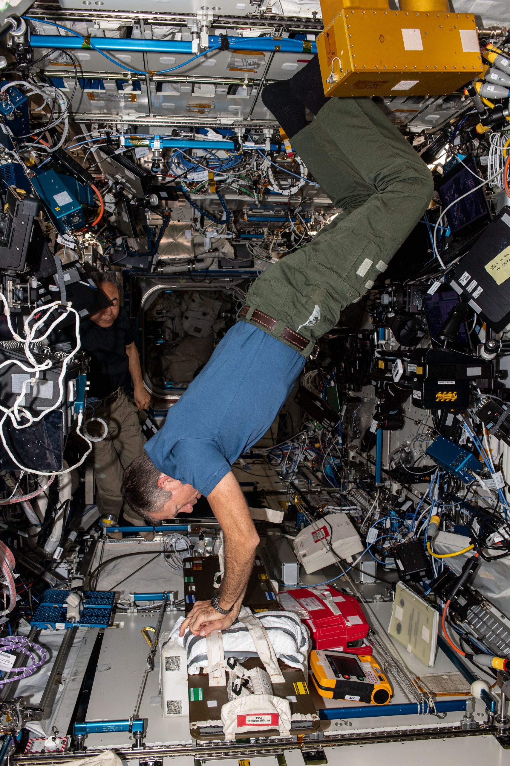 Astronaut Andreas Mogensen practices chest compressions, or CPR