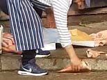 Disgusting moment fishmonger repeatedly throws frozen seafood down on to the pavement outside East London shop as council launch food hygiene investigation