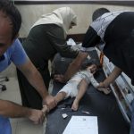 Bodies line Gaza hospital wall and surgeons operate in corridors