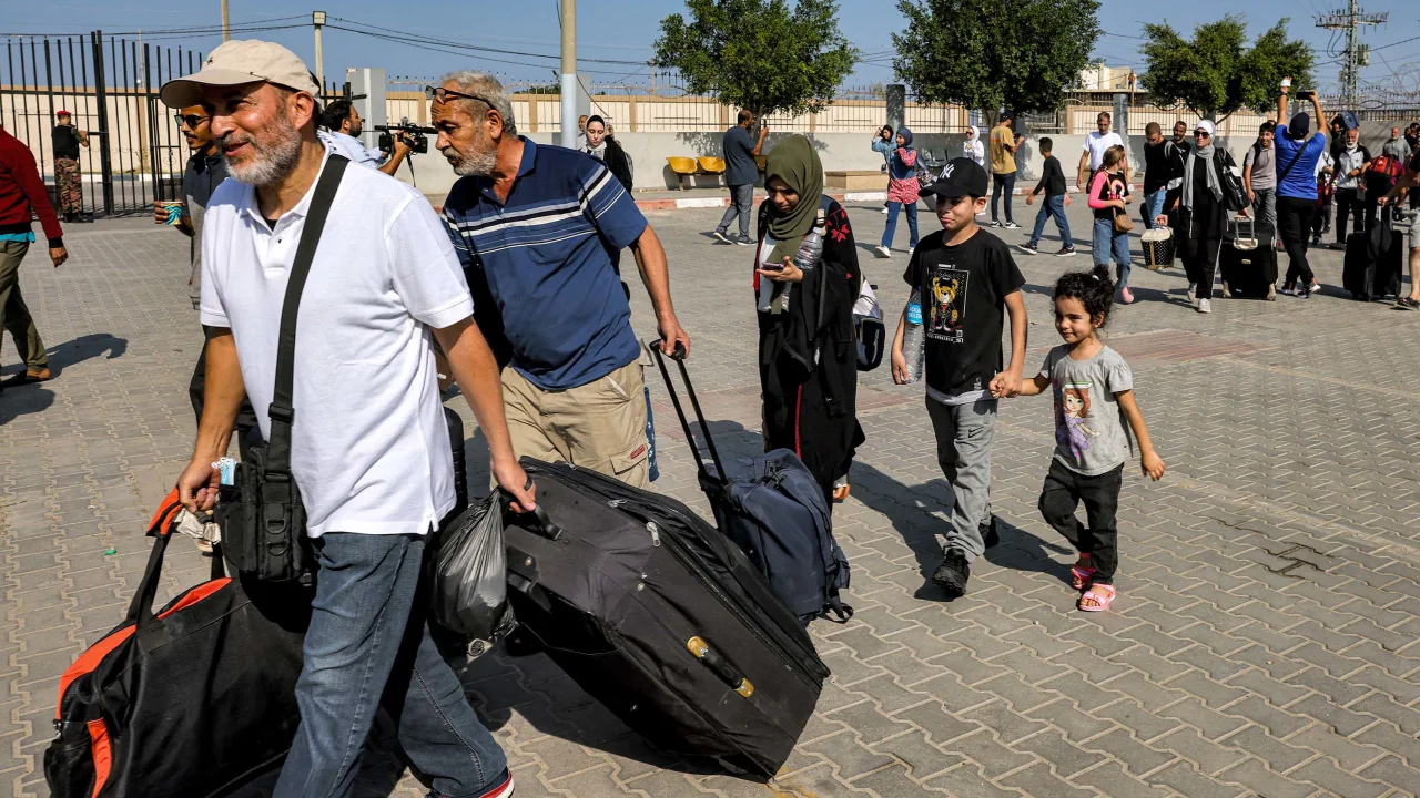 Injured Palestinians cross Gaza border into Egypt, the first allowed out since Israel-Hamas war began