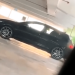 A randy couple filmed having sex in the car at a parking lot (VIDEO).