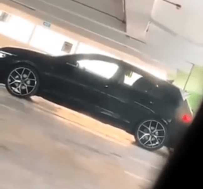 A randy couple filmed having sex in the car at a parking lot (VIDEO).