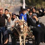 Gazans raise white flags to flee Israeli onslaught on foot