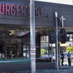 Palestinian owner of burger chain urges supporters not to rally after suspicious fire