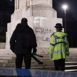 Fury as pro-Palestinian supporters deface war memorial with Manchester Police standing guard