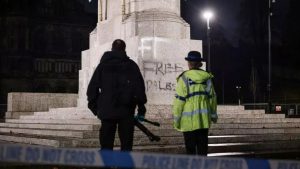 Fury as pro-Palestinian supporters deface war memorial with Manchester Police standing guard