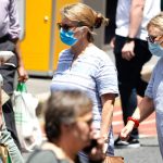 Masks to return in public hospitals as authorities monitor COVID surge