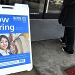 US applications for jobless benefits fall again as labor market continues to thrive