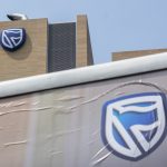 Standard Bank, hit by naira devaluation – but not knocked out