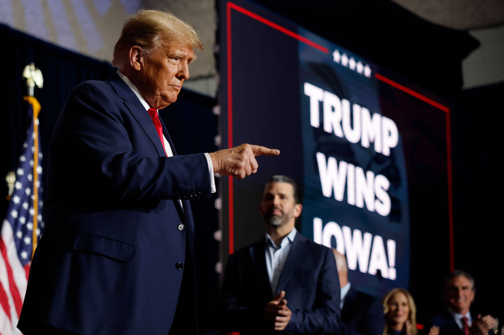 Trump takes Iowa caucus as supporters brave weather to ‘make America great again’, again