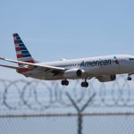 An American Airlines flight attendant was charged over claims he photographed minors in airplane bathrooms