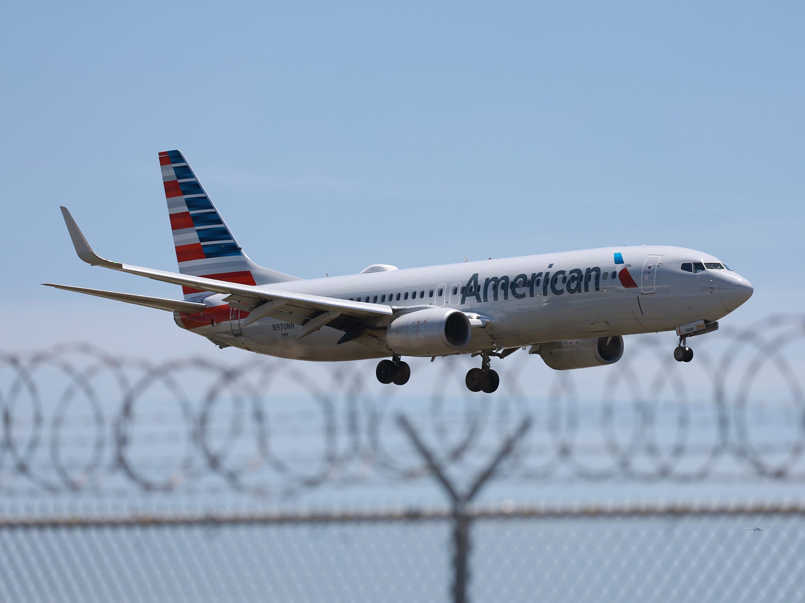 An American Airlines flight attendant was charged over claims he photographed minors in airplane bathrooms