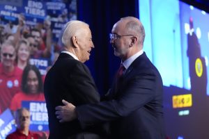 UAW’s Shawn Fain says Trump ‘doesn’t care about the American worker’ as union backs Biden for re-election