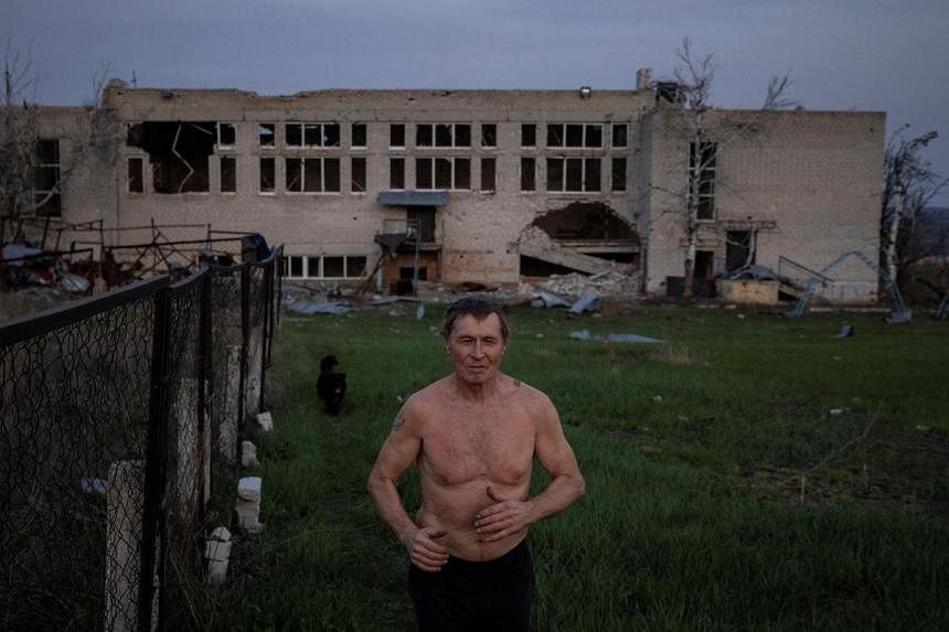 In his home near Ukraine’s front line with Russia, Yurii makes a stand